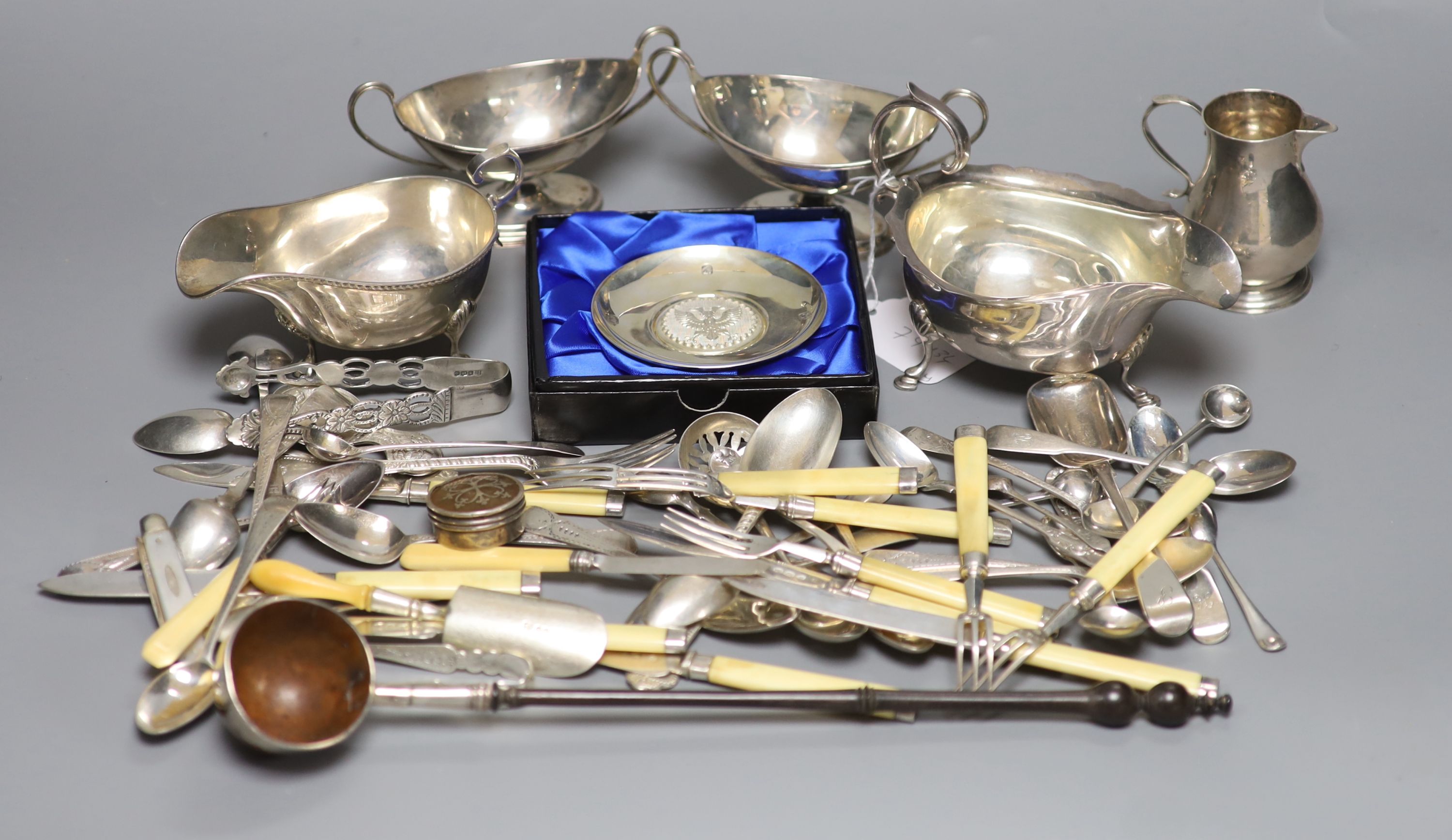 Two George V sauceboats, a pair of George III silver salts, a later sparrow beak cream jug and sundry small silverwares including flatware
